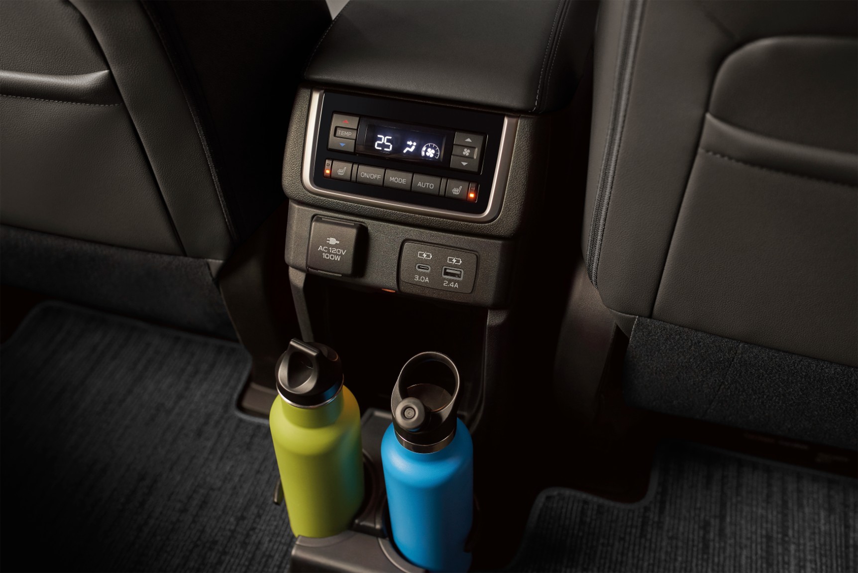 Subaru Evoltis rear passenger air conditioning controls. Just below is are USB device charging ports and beverage container holders