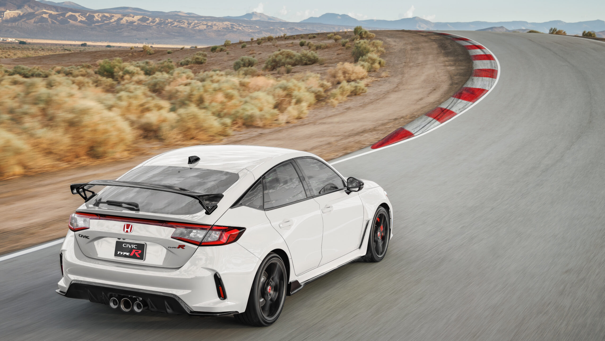 Honda Civic Type R FL5 right rear quarter panel view on a racetrack
