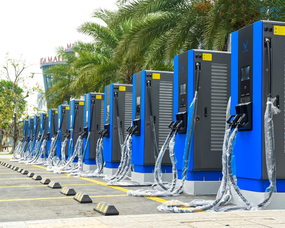 A row of V Green EV charging panels