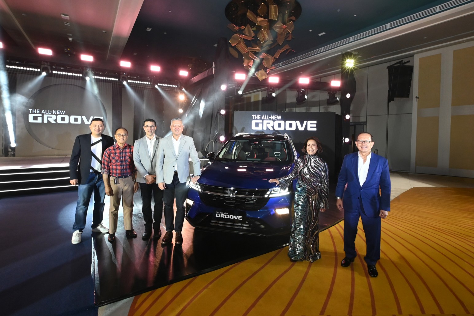 Chevrolet Philipines and HARI executive pose with the newly launched Chevy Groove