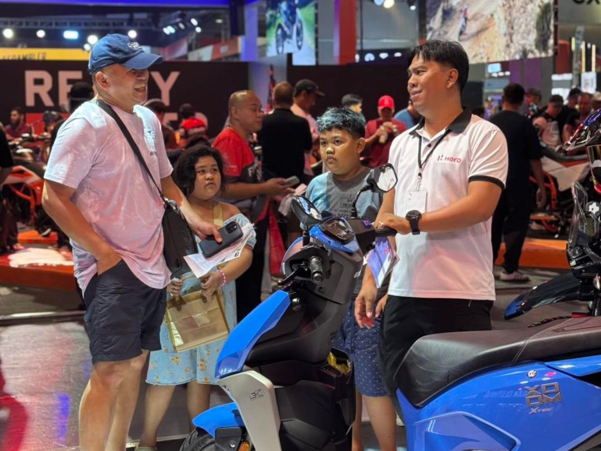 Interested visitors of the Hero Booth at a motorcycle conventopn