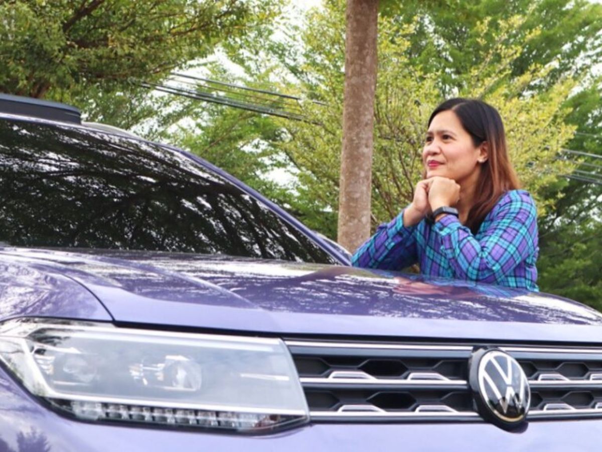 Stara Mae Tiongco, a high school teacher in Cagayan de Oro City, with her Syringa Violet Volkswagen T-Cross