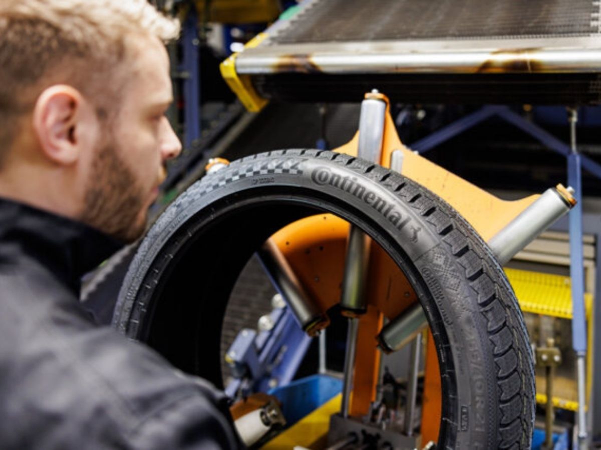 Continental Tire worker inspecting tire