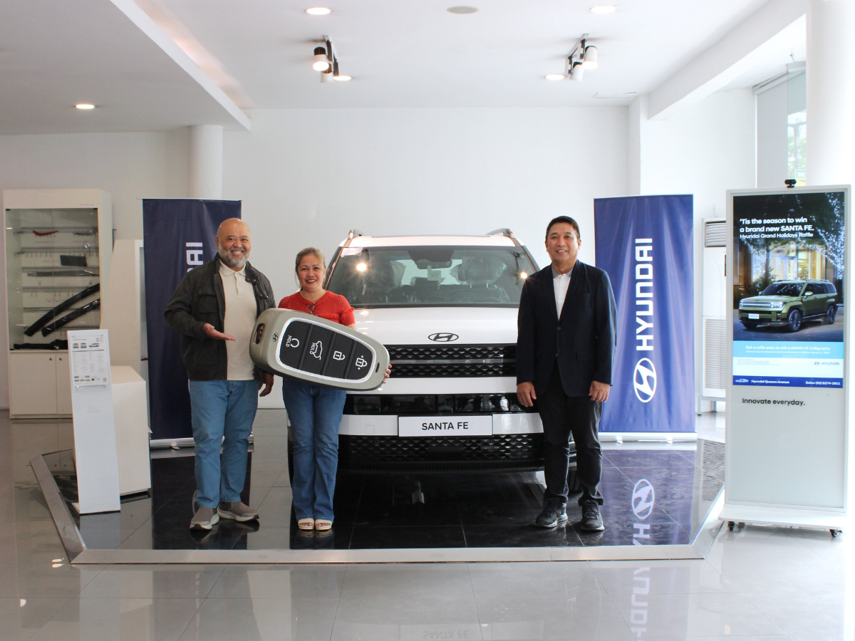 From left: President of ESJAY Auto Corp & Dealer Principal of Hyundai Quezon Avenue, Mr. Leo Anthony P. San Juan, Brand-new SANTA FE Winner, Ms. Erlinda L. Añonuevo, and HMPH Managing Director, Mr. Cecil Capacete.